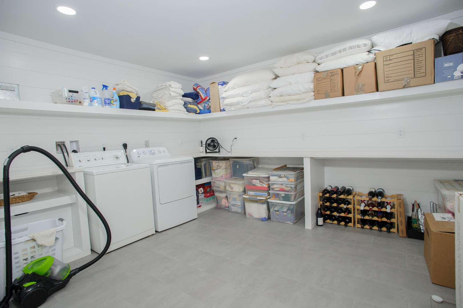 31 North Street Edgartown, MA 02539 - Photo 42 of 49 a storage room with lots of clutter and cabinets