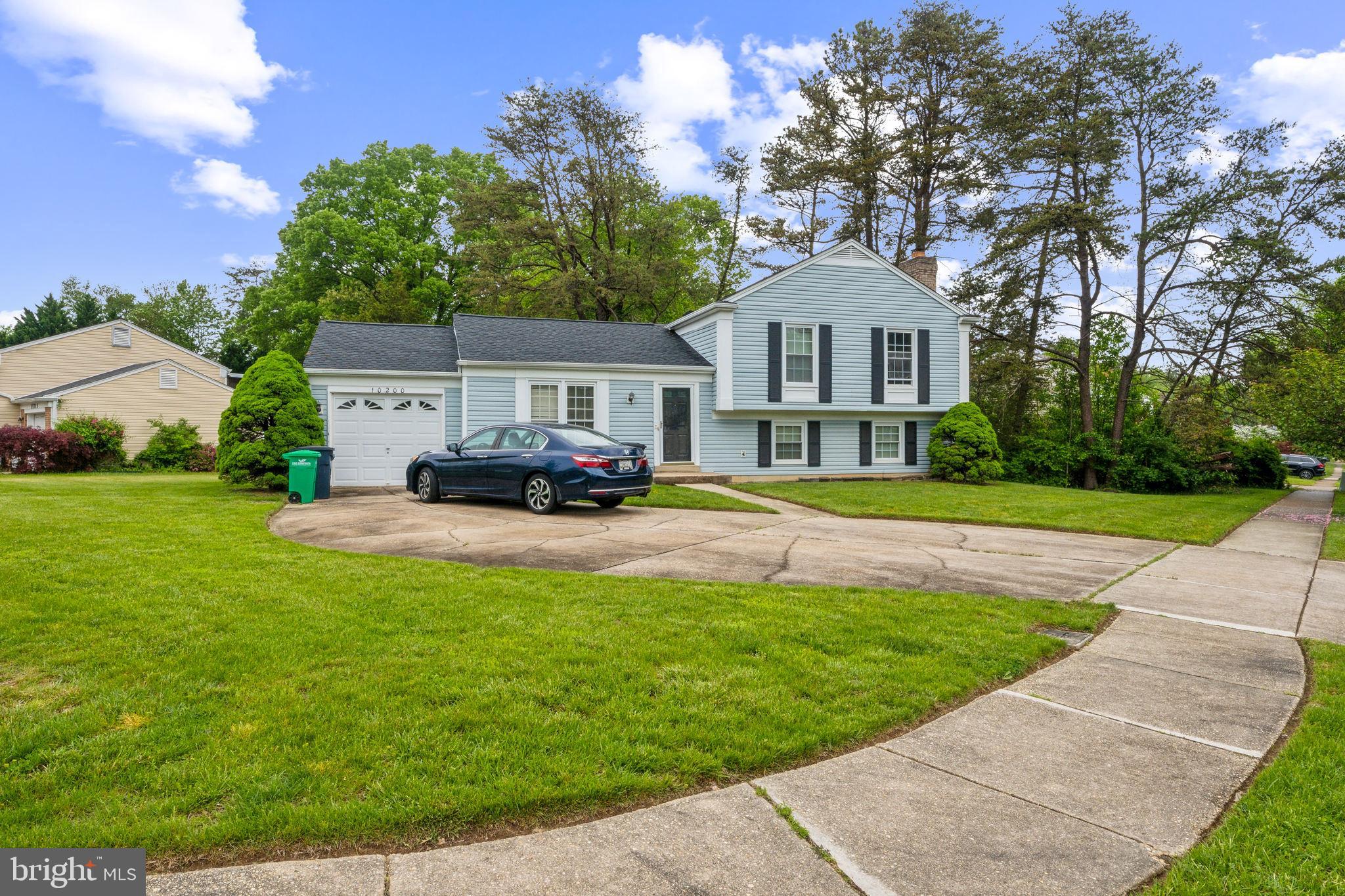 10200 Balsamwood Drive Laurel, MD 20708 - Photo 1 of 11 a front view of a house with a yard