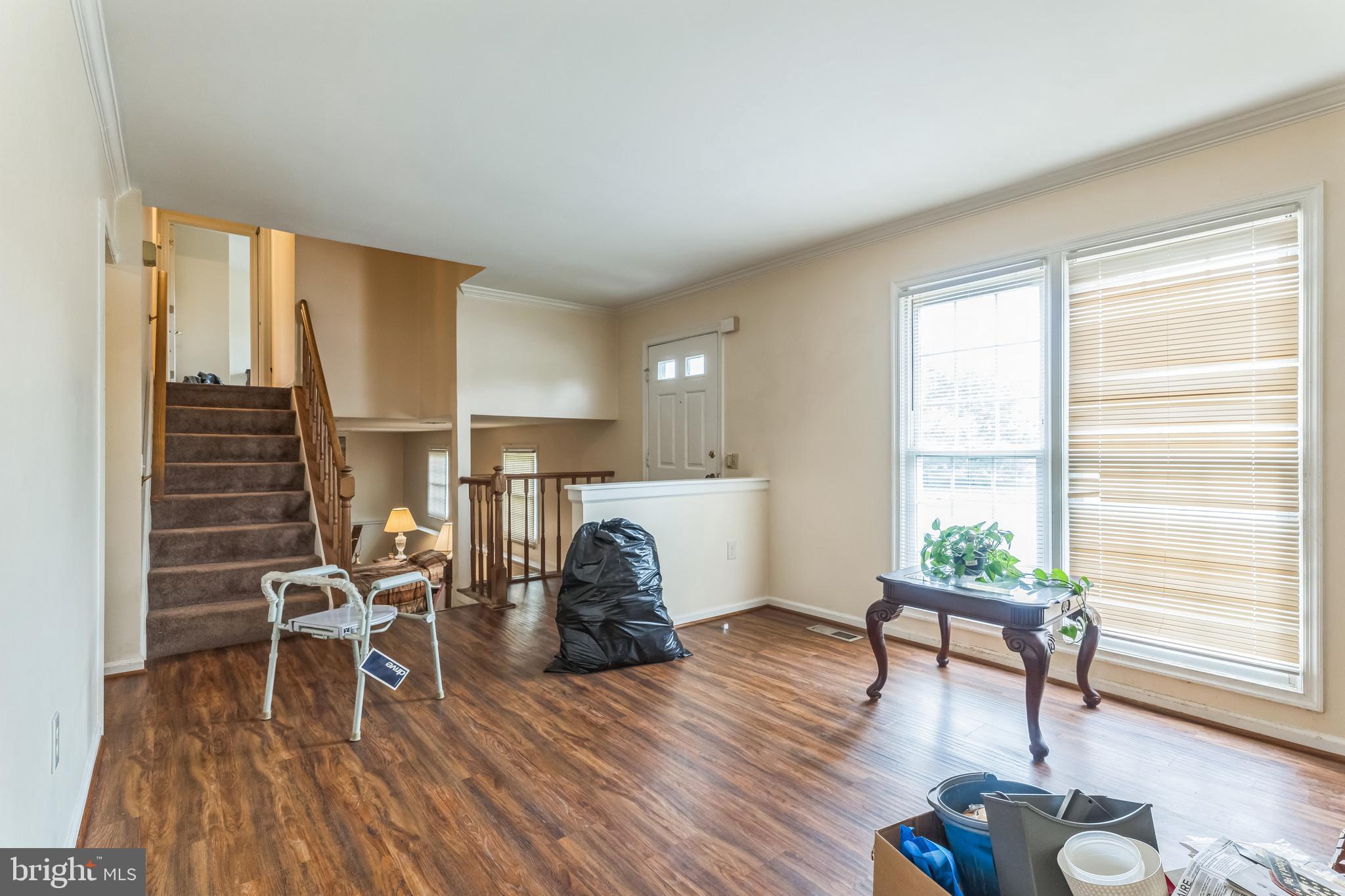 10200 Balsamwood Drive Laurel, MD 20708 - Photo 3 of 11 a living room with furniture and a wooden floor