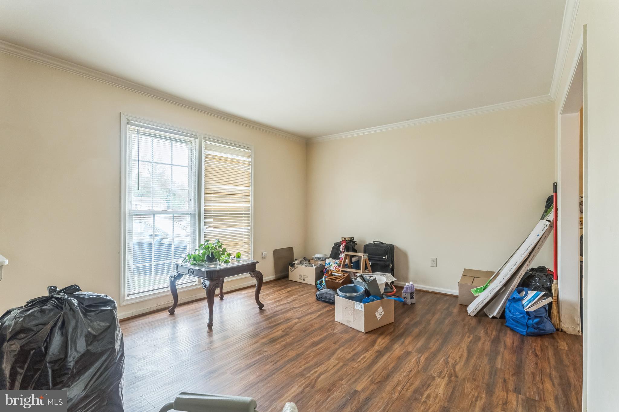 10200 Balsamwood Drive Laurel, MD 20708 - Photo 4 of 11 a living room with furniture and a wooden floor