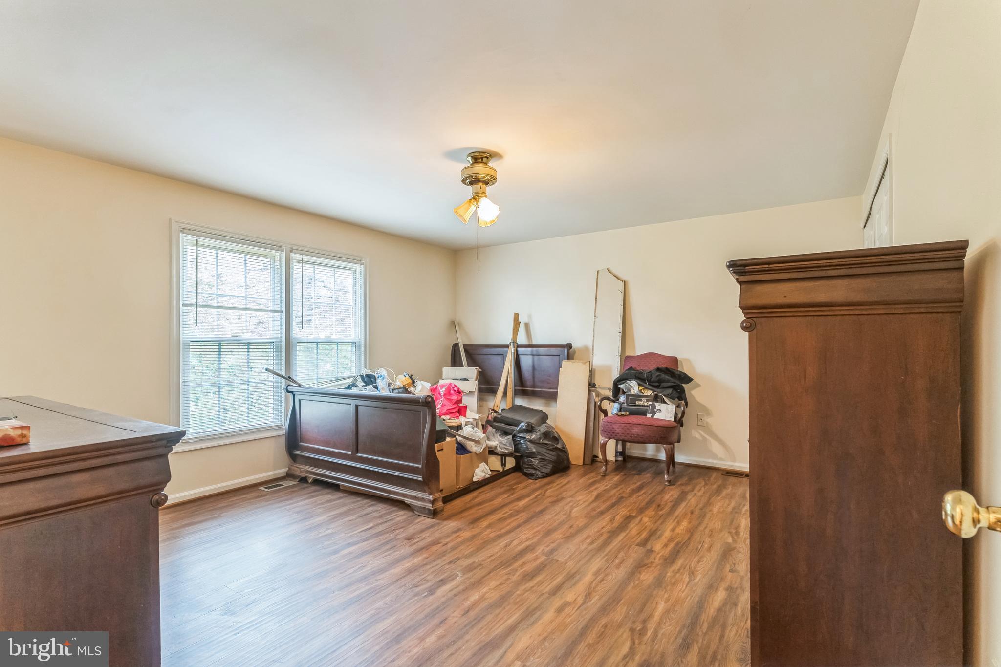 10200 Balsamwood Drive Laurel, MD 20708 - Photo 8 of 11 a living room with furniture and a window