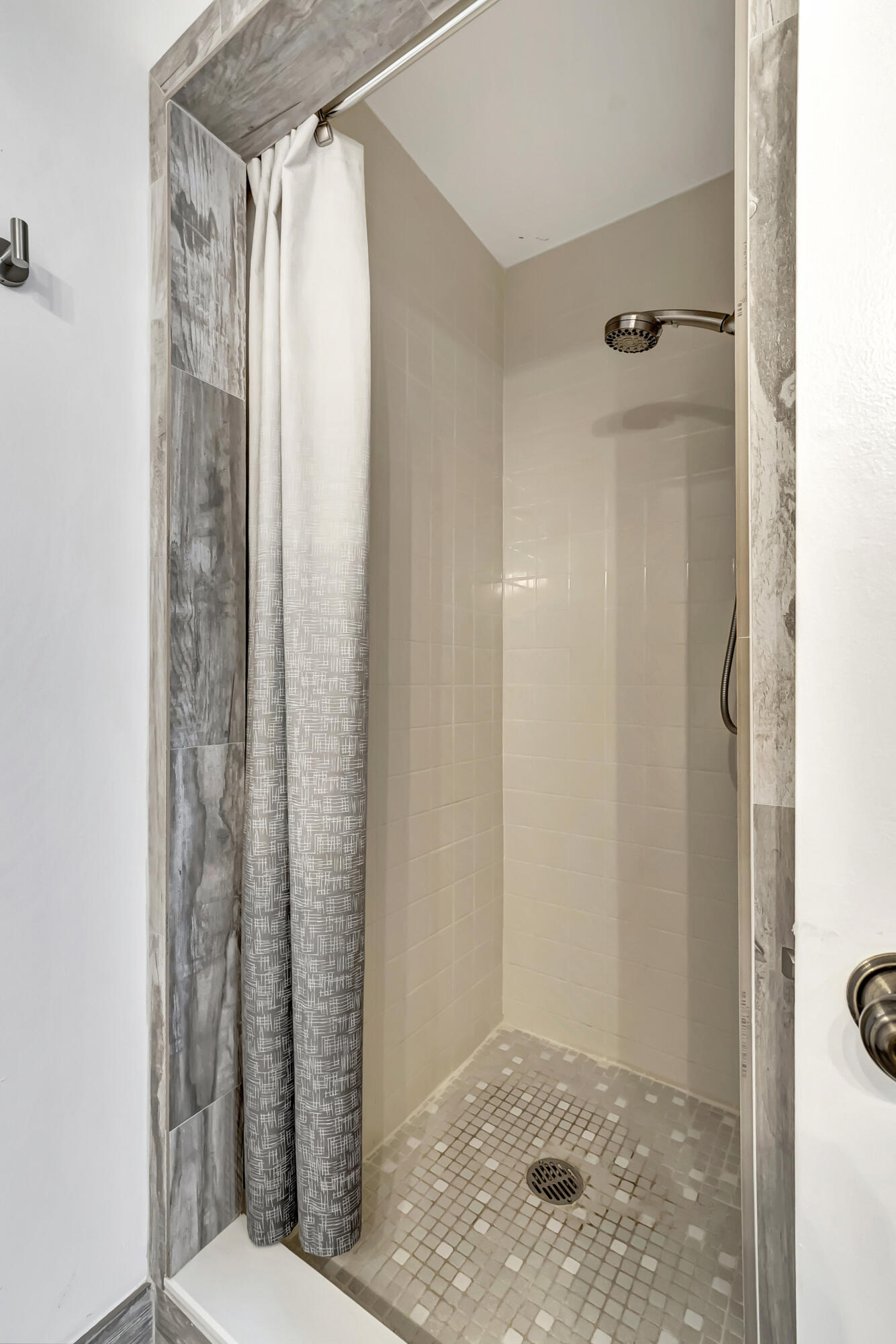 14040 Nesting Way, Unit B Delray Beach, FL 33484 - Photo 18 of 26 a bathroom with a shower and a toilet