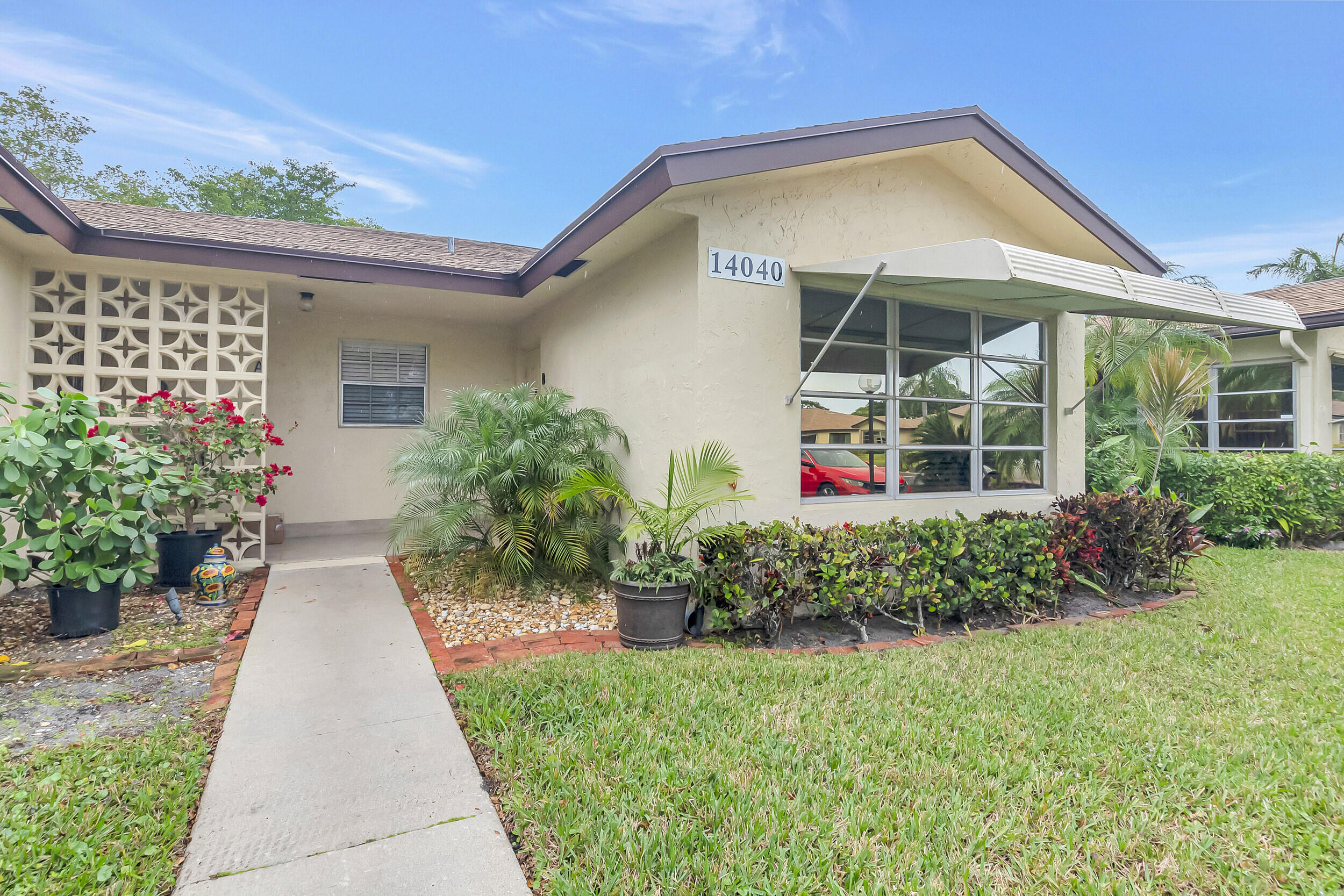 14040 Nesting Way, Unit B Delray Beach, FL 33484 - Photo 2 of 26 a porch with seating space