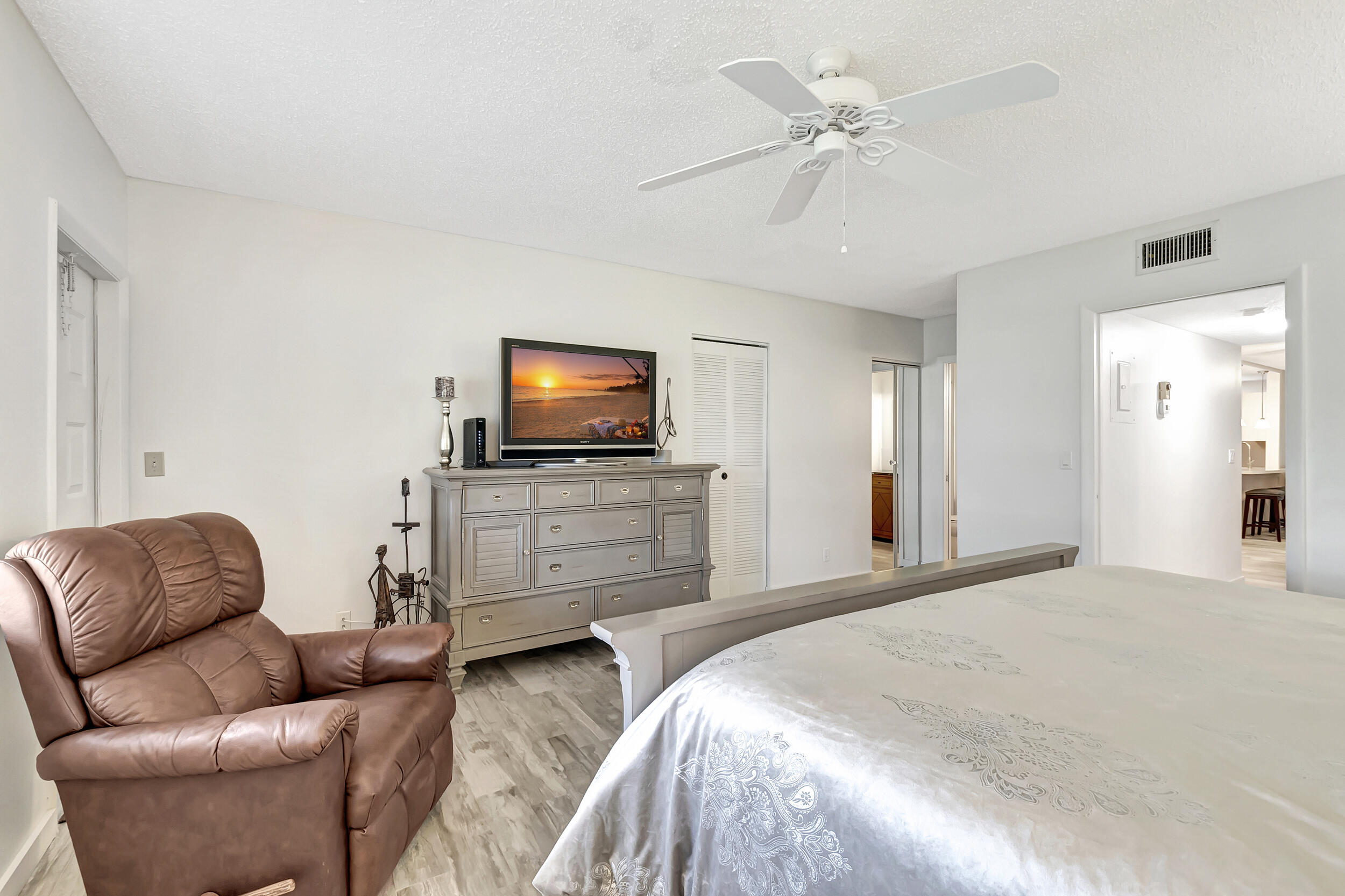 14040 Nesting Way, Unit B Delray Beach, FL 33484 - Photo 21 of 26 a living room with furniture and a flat screen tv