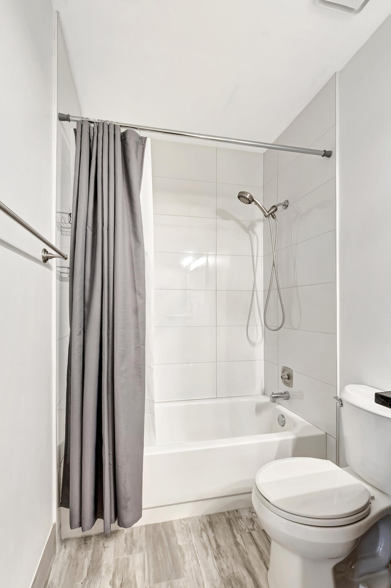 14040 Nesting Way, Unit B Delray Beach, FL 33484 - Photo 23 of 26 a bathroom with a toilet and a shower