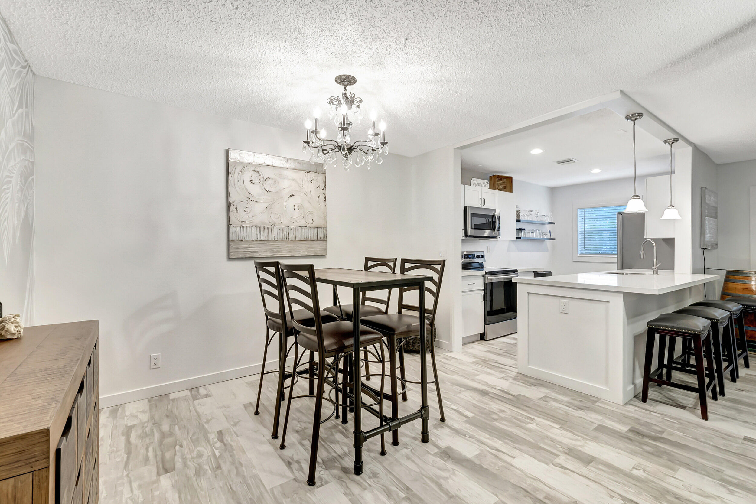 14040 Nesting Way, Unit B Delray Beach, FL 33484 - Photo 10 of 26 a view of a dining room with furniture and wooden floor