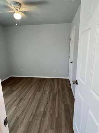 wooden floor in a white room