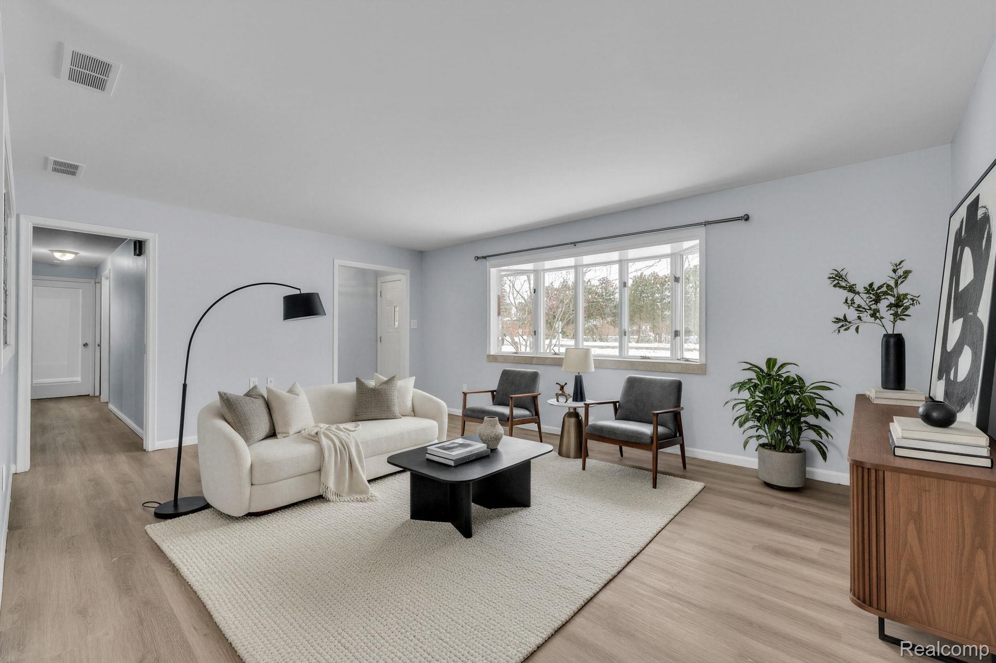 6576 Inkster Road West Bloomfield, MI 48322 - Photo 2 of 62 Living room featuring light wood finished floors