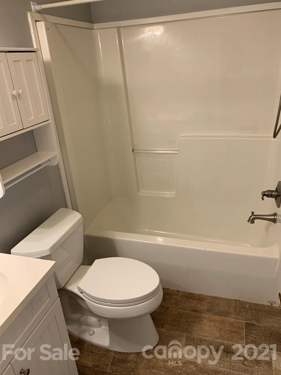 7596 Lowesville Meadows Road Stanley, NC 28164 - Photo 12 of 23 a bathroom with a toilet and a shower