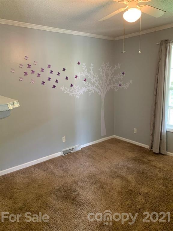 7596 Lowesville Meadows Road Stanley, NC 28164 - Photo 15 of 23 a view of an empty room