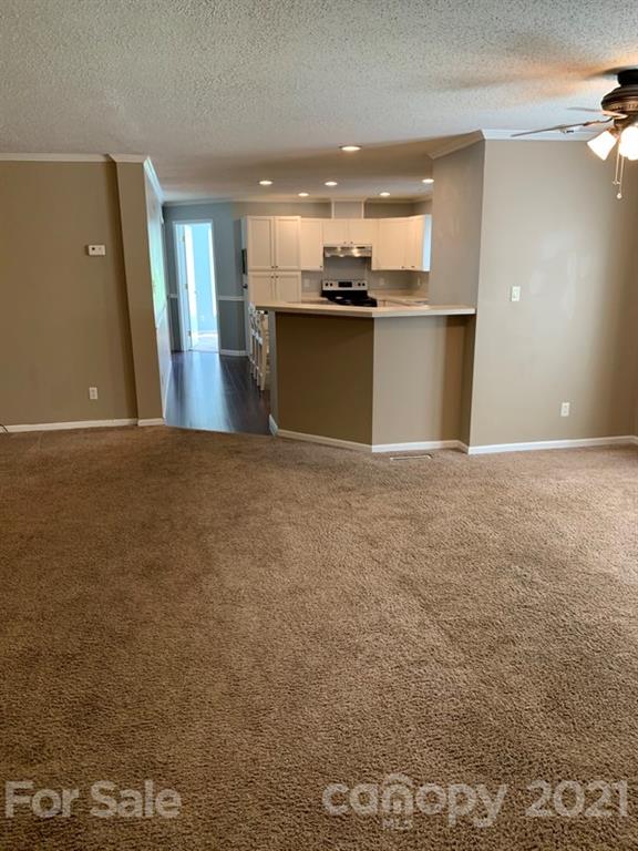 7596 Lowesville Meadows Road Stanley, NC 28164 - Photo 6 of 23 a view of a kitchen with a sink