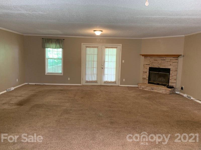 7596 Lowesville Meadows Road Stanley, NC 28164 - Photo 7 of 23 an empty room with windows