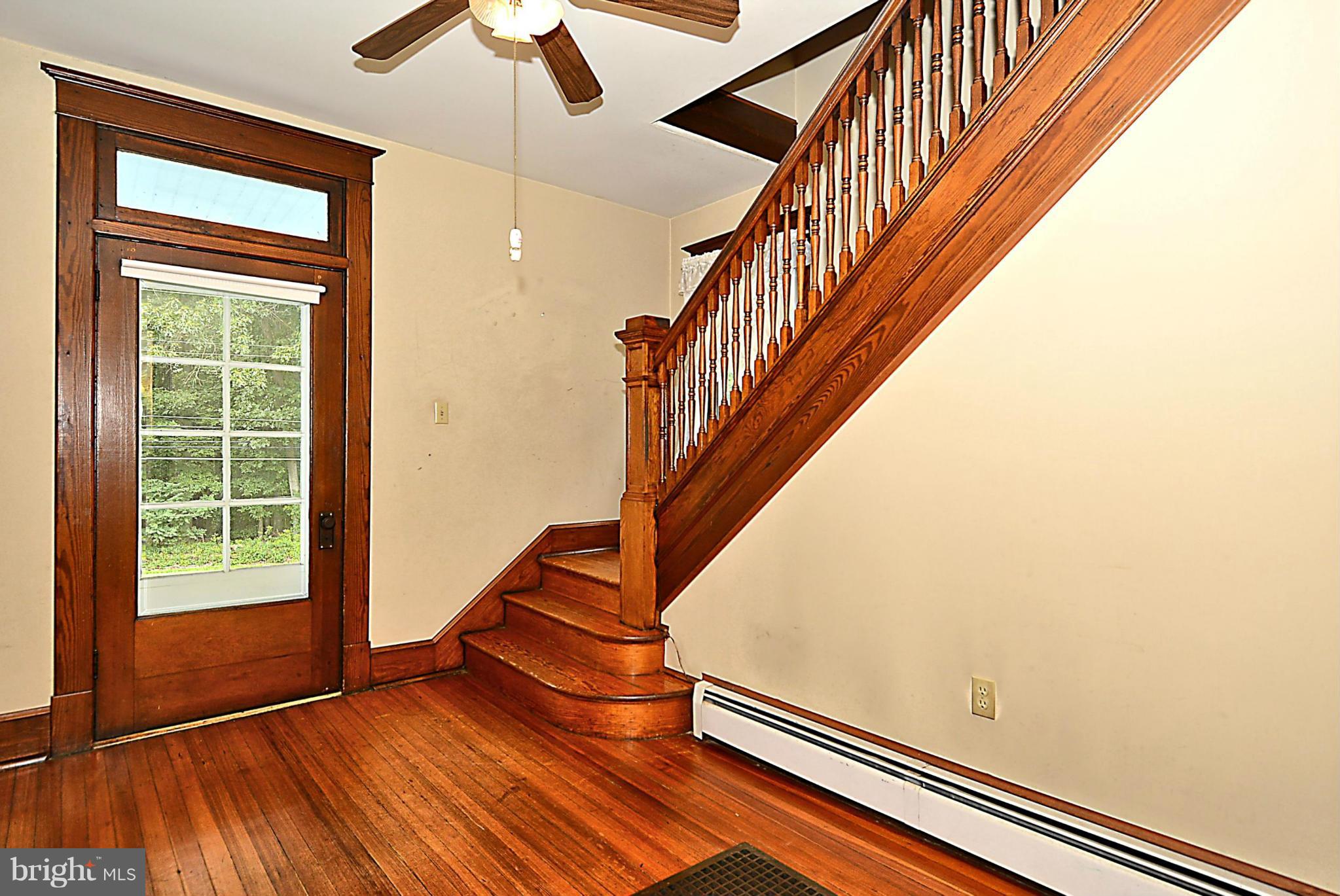 15425 Barnesville Road Boyds, MD 20841 - Photo 4 of 30 an entryway in a hall with a window and wooden floor