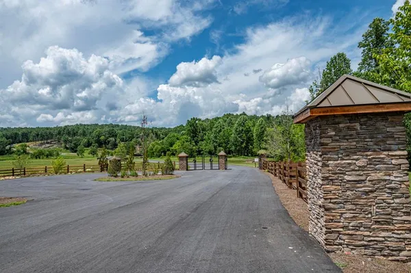 a pathway of a house with a yard
