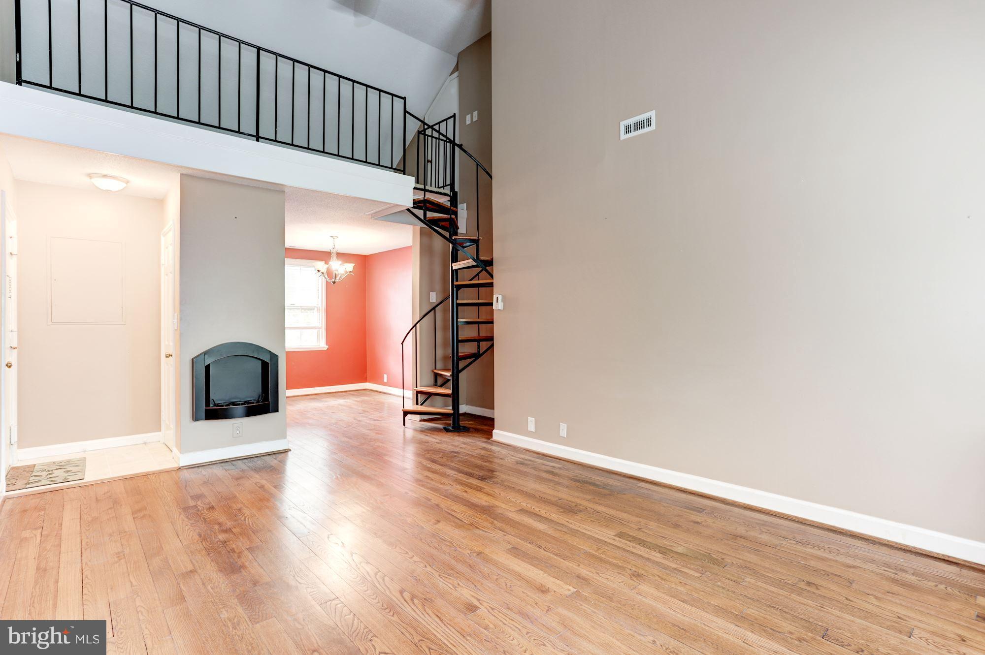 4608 31st Road South, Unit B2 Arlington, VA 22206 - Photo 6 of 29 a view of a room with wooden floor and stairs