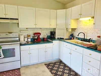780 Vineyard Road Concord, VA 24538 - Photo 14 of 26 a kitchen with stainless steel appliances white cabinets and a sink