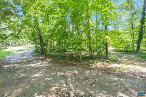 a view of a swimming pool with an outdoor space and seating area