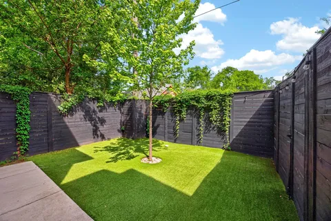 a view of a backyard with a garden