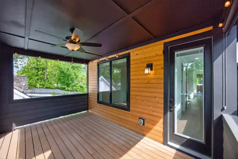 a view of a room with wooden floor and outdoor space