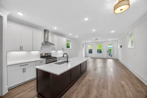 a kitchen with a sink and cabinets