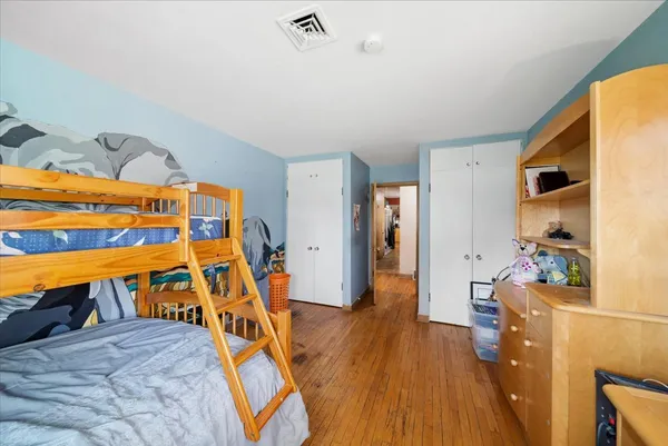 a view of an entryway with wooden floor