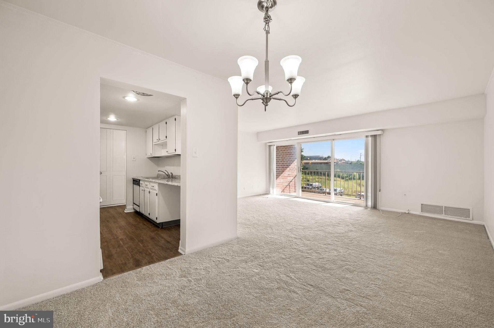 401 Drummers Lane Wayne, PA 19087 - Photo 8 of 21 Huge living room with sliding glass doors