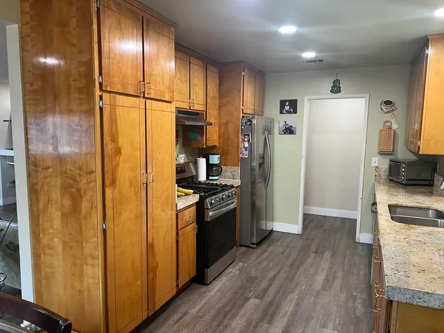 a living room with lots of furniture and a rug