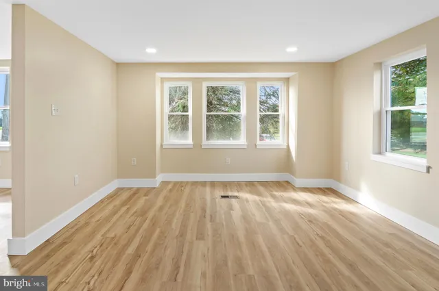 a large kitchen with cabinets and stainless steel appliances