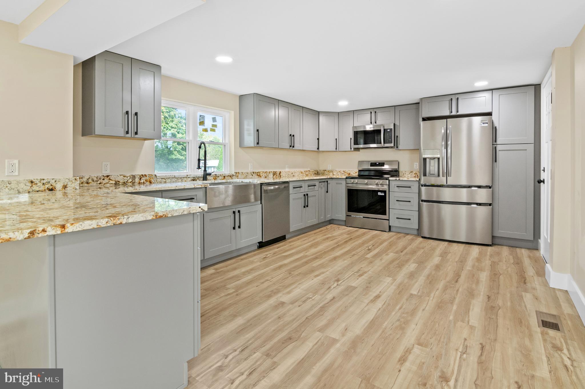1741 Liberty Grove Road Colora, MD 21917 - Photo 15 of 55 a large kitchen with cabinets and stainless steel appliances
