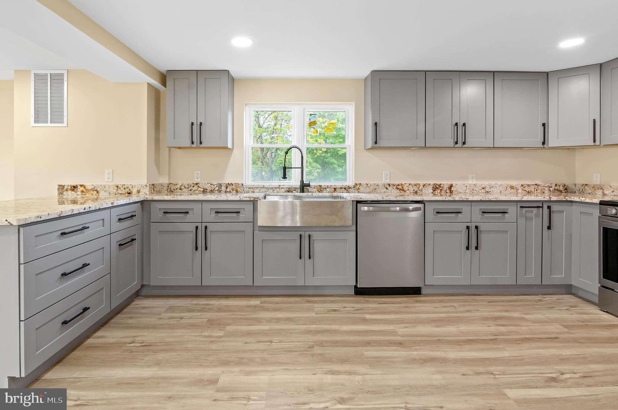 1741 Liberty Grove Road Colora, MD 21917 - Photo 16 of 55 a kitchen with stainless steel appliances granite countertop a stove a sink and a microwave