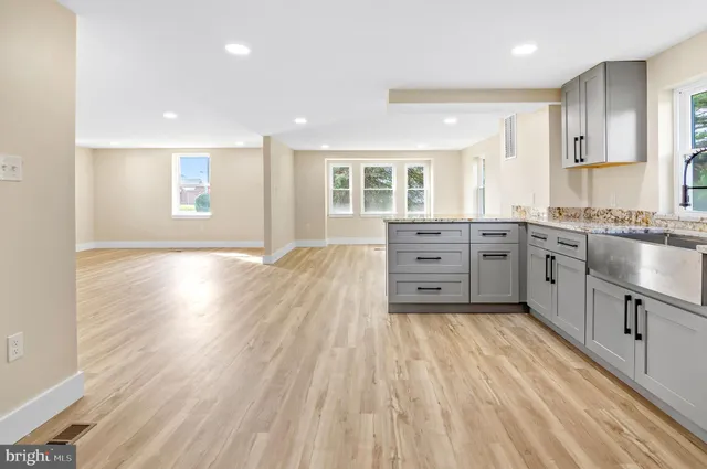 a view of a kitchen with wooden floor
