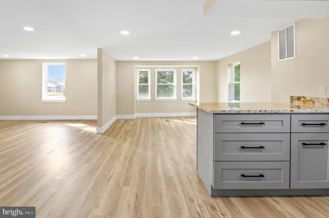 an empty room with closet and mirror