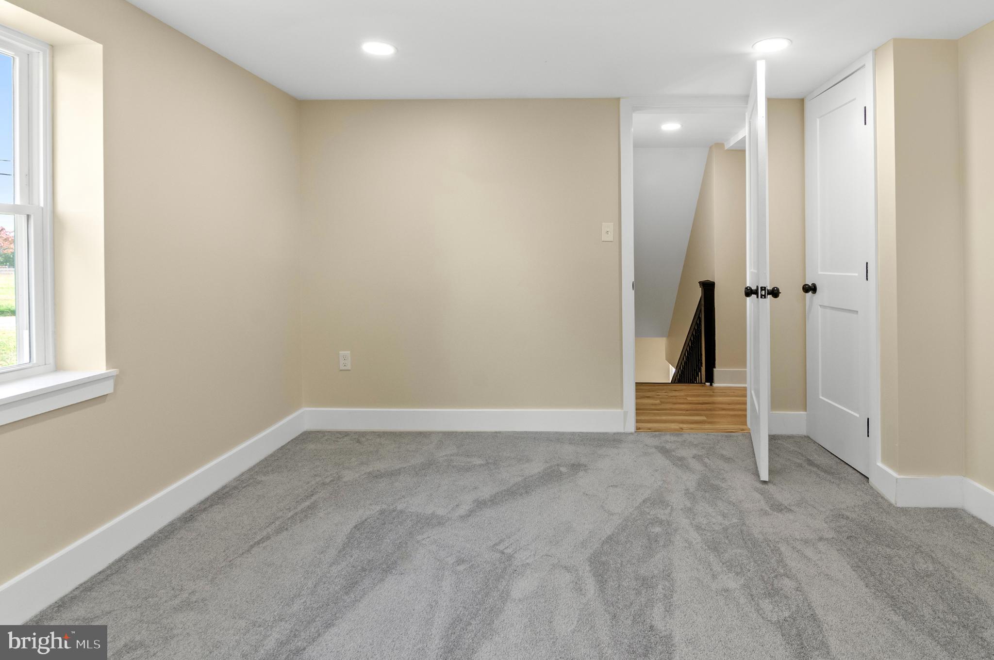 1741 Liberty Grove Road Colora, MD 21917 - Photo 21 of 55 an empty room with closet and mirror