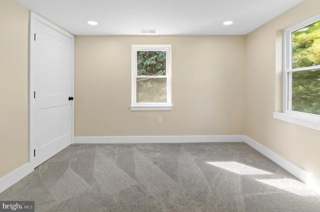 an empty room with windows