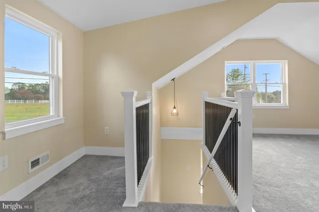 a view of balcony with wooden floor