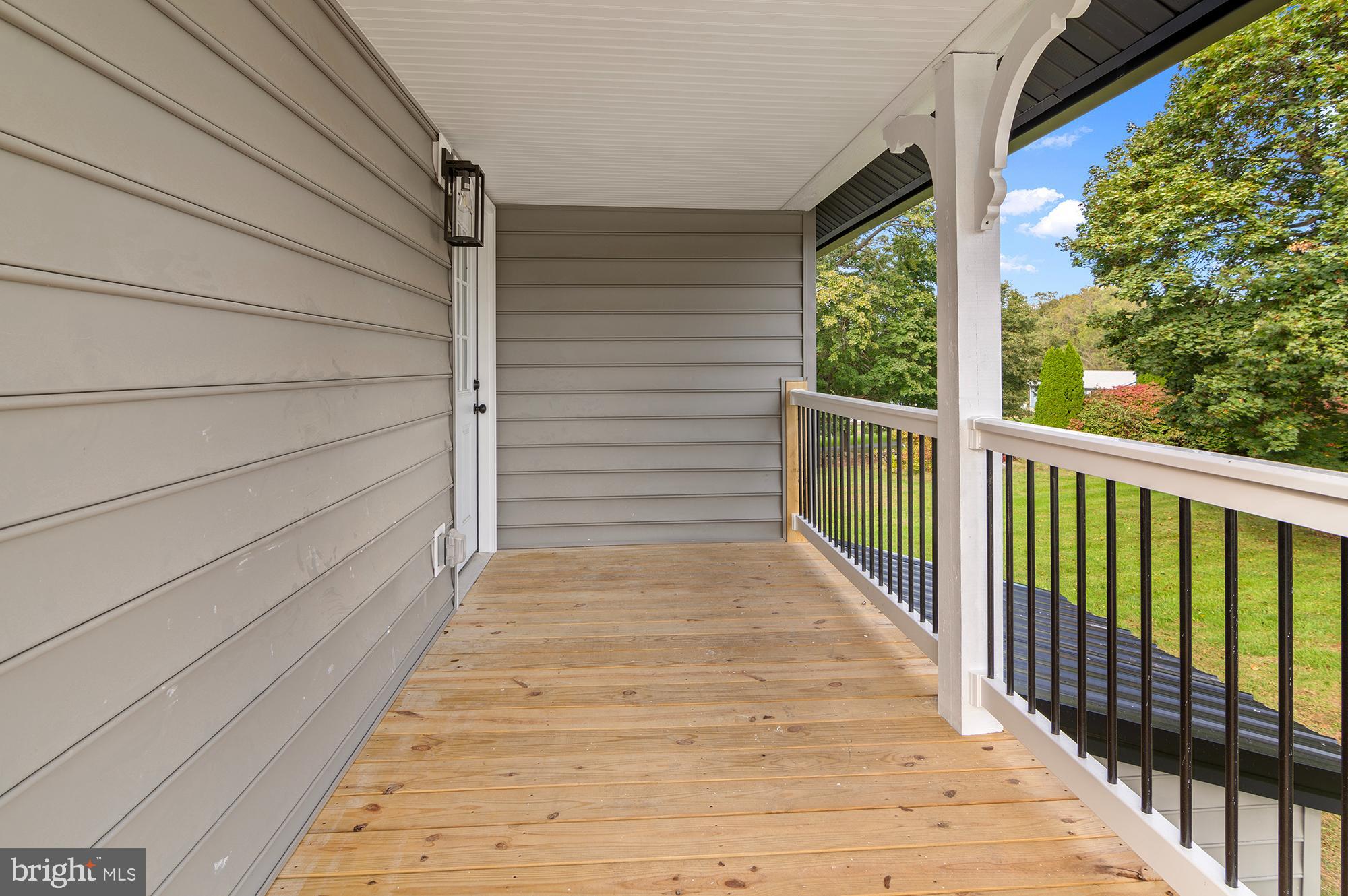 1741 Liberty Grove Road Colora, MD 21917 - Photo 44 of 55 a view of balcony with wooden floor and fence
