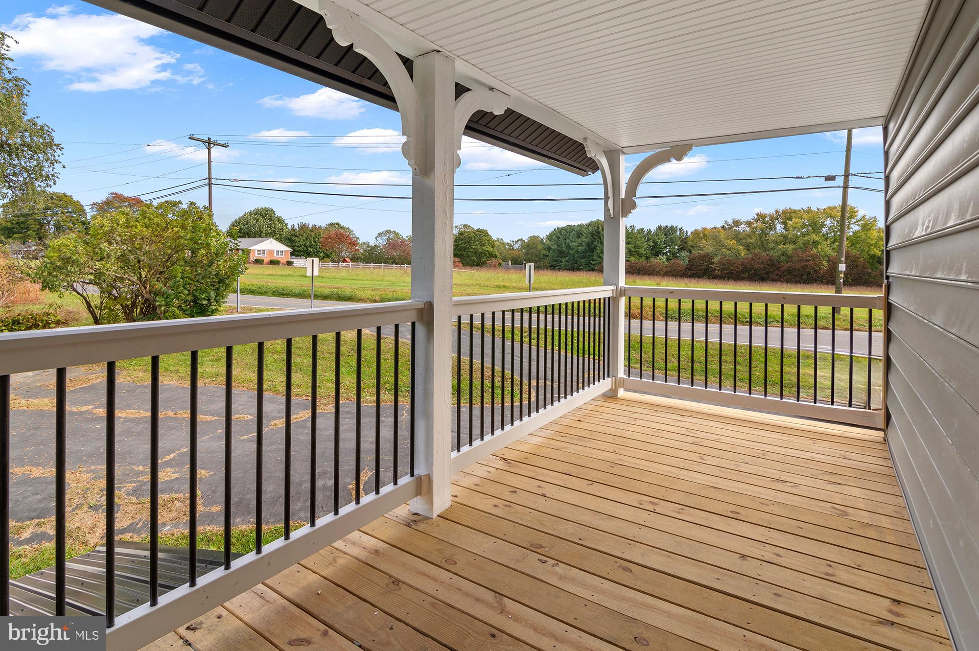 1741 Liberty Grove Road Colora, MD 21917 - Photo 45 of 55 a view of balcony with wooden floor