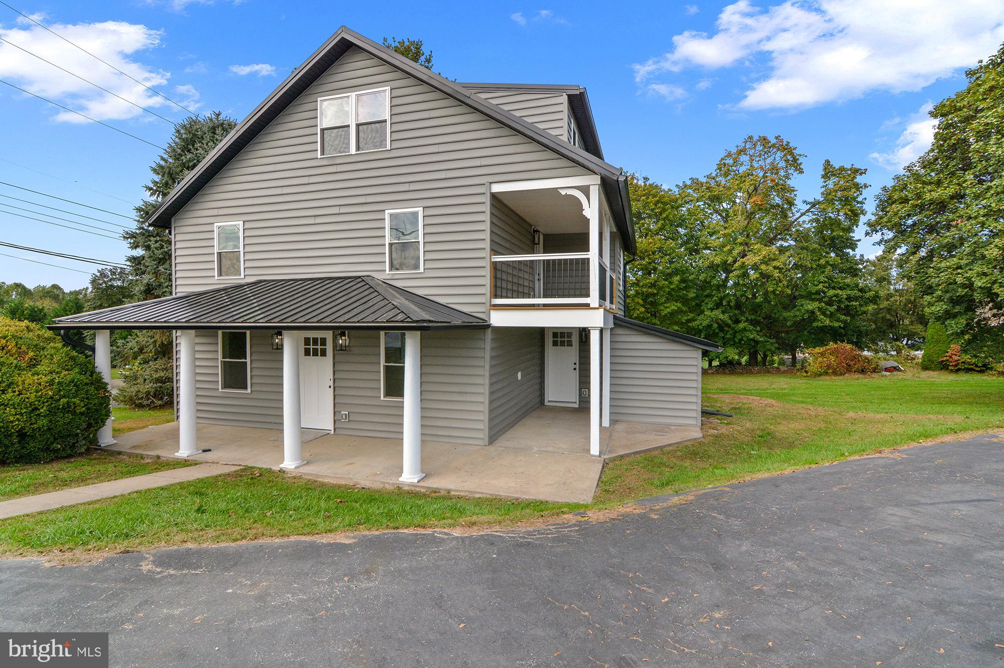 1741 Liberty Grove Road Colora, MD 21917 - Photo 52 of 55 a front view of a house with a yard and garage
