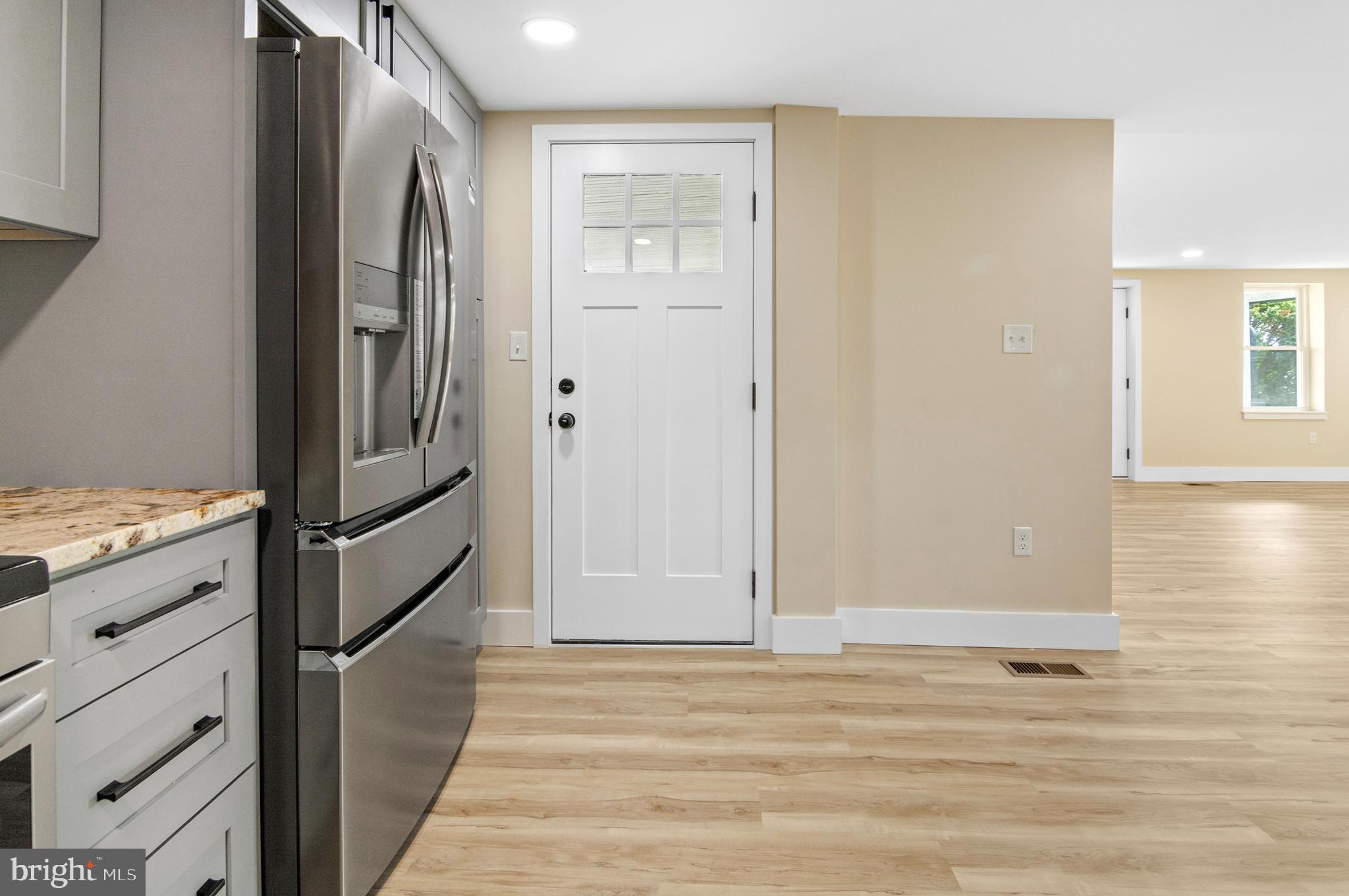 1741 Liberty Grove Road Colora, MD 21917 - Photo 7 of 55 a view of kitchen with refrigerator and wooden floor