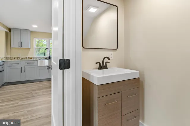 a bathroom with a sink and a mirror