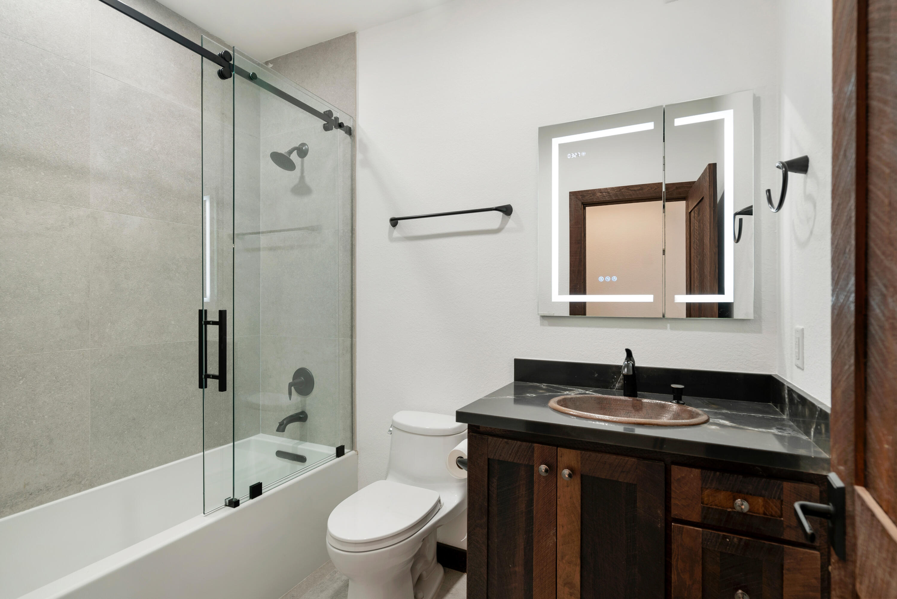 85 Henry Morgan Drive Key Largo, FL 33037 - Photo 14 of 40 a bathroom with a granite countertop sink toilet and shower