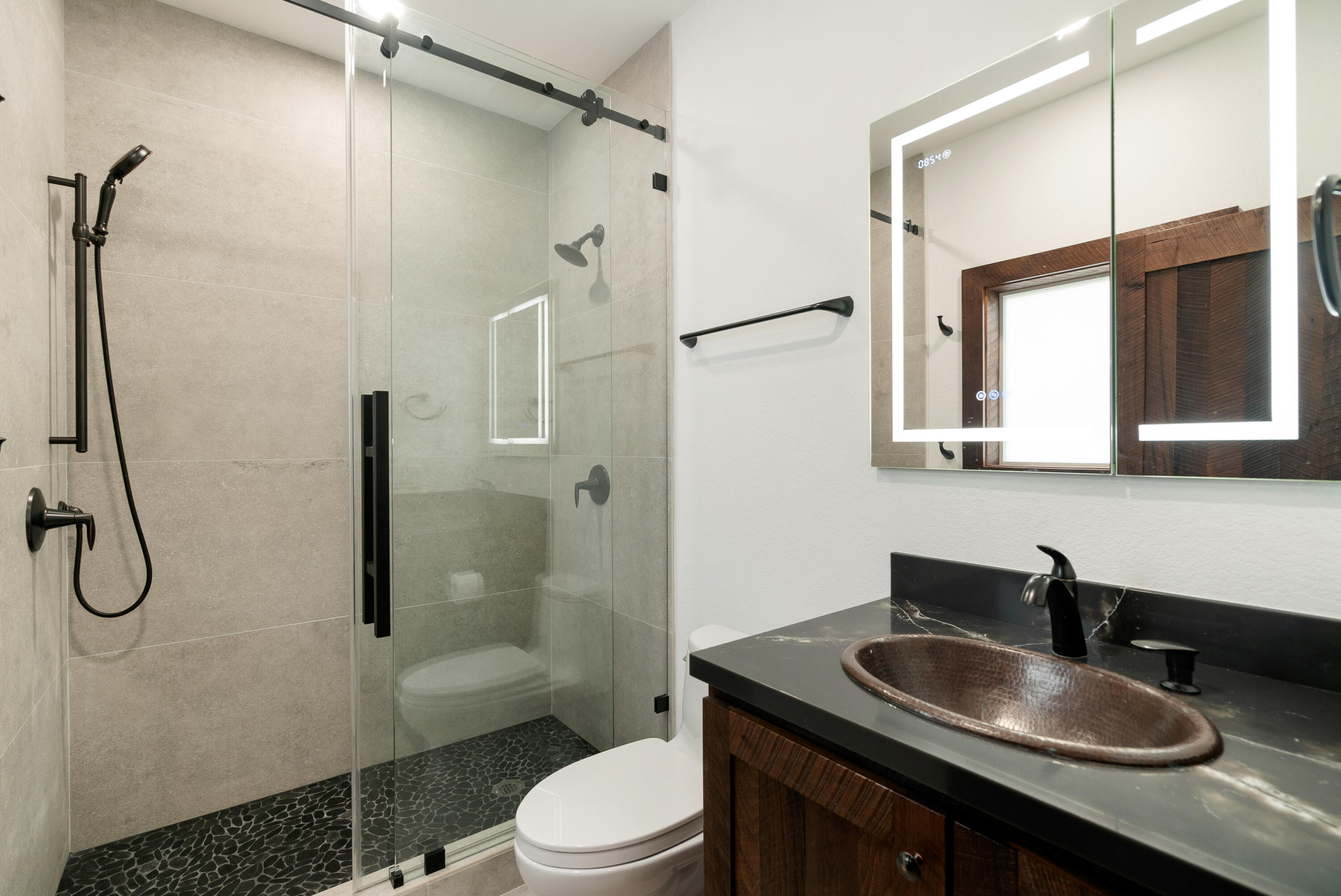 85 Henry Morgan Drive Key Largo, FL 33037 - Photo 17 of 40 a bathroom with a granite countertop sink a toilet and shower