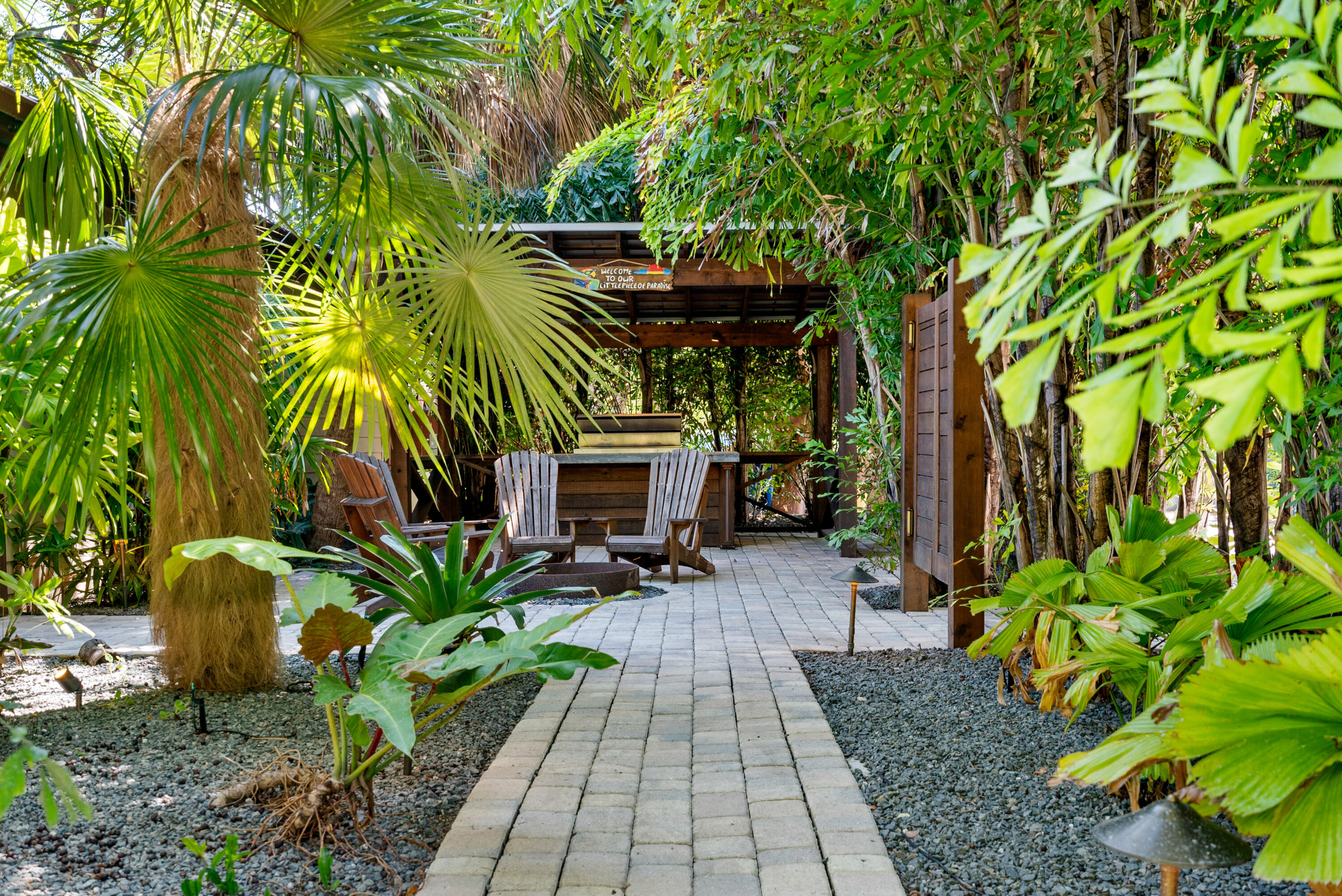 85 Henry Morgan Drive Key Largo, FL 33037 - Photo 3 of 40 a view of backyard with plants and outdoor seating