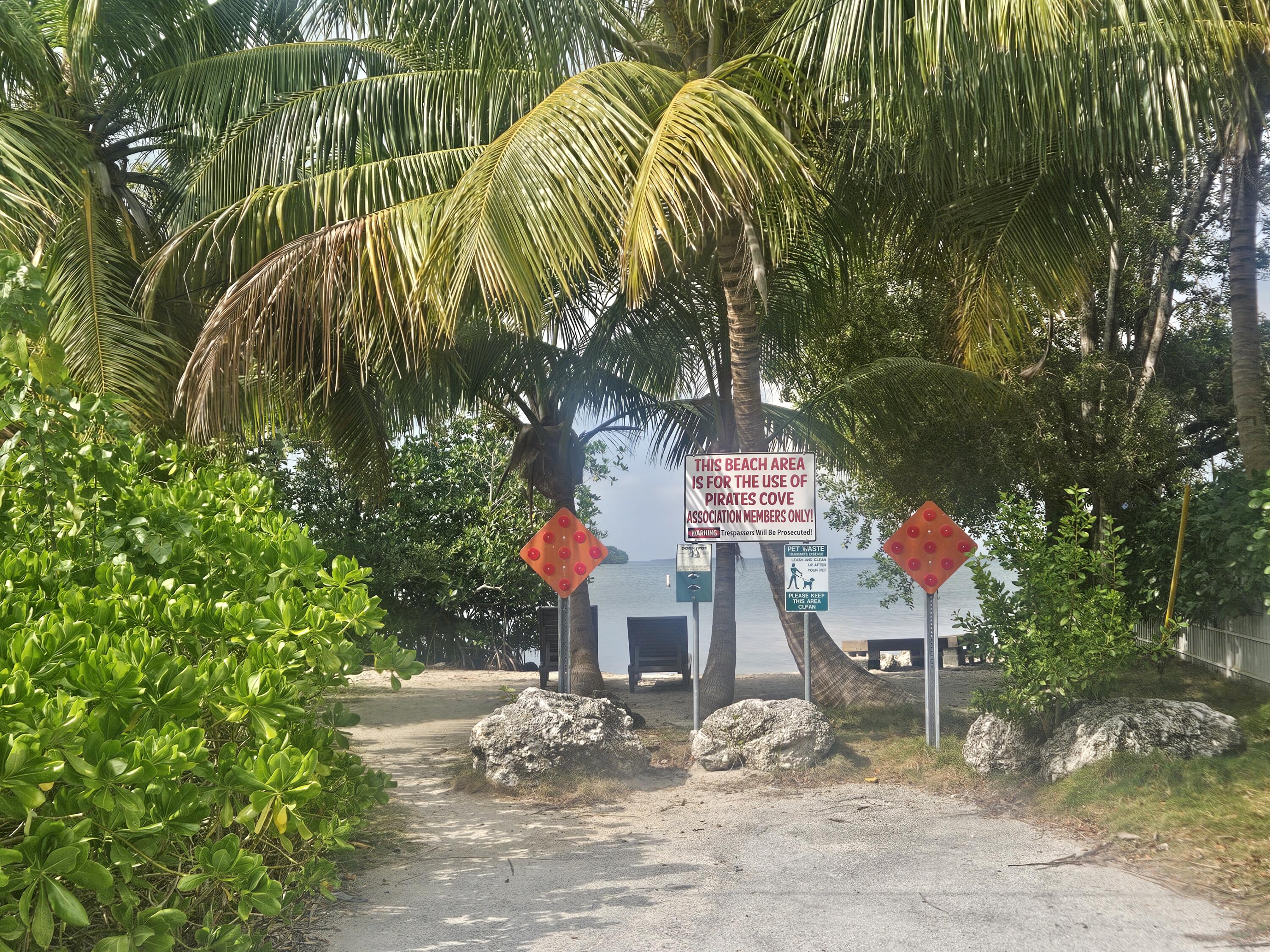85 Henry Morgan Drive Key Largo, FL 33037 - Photo 34 of 40 a outdoor space with lots of potted plants