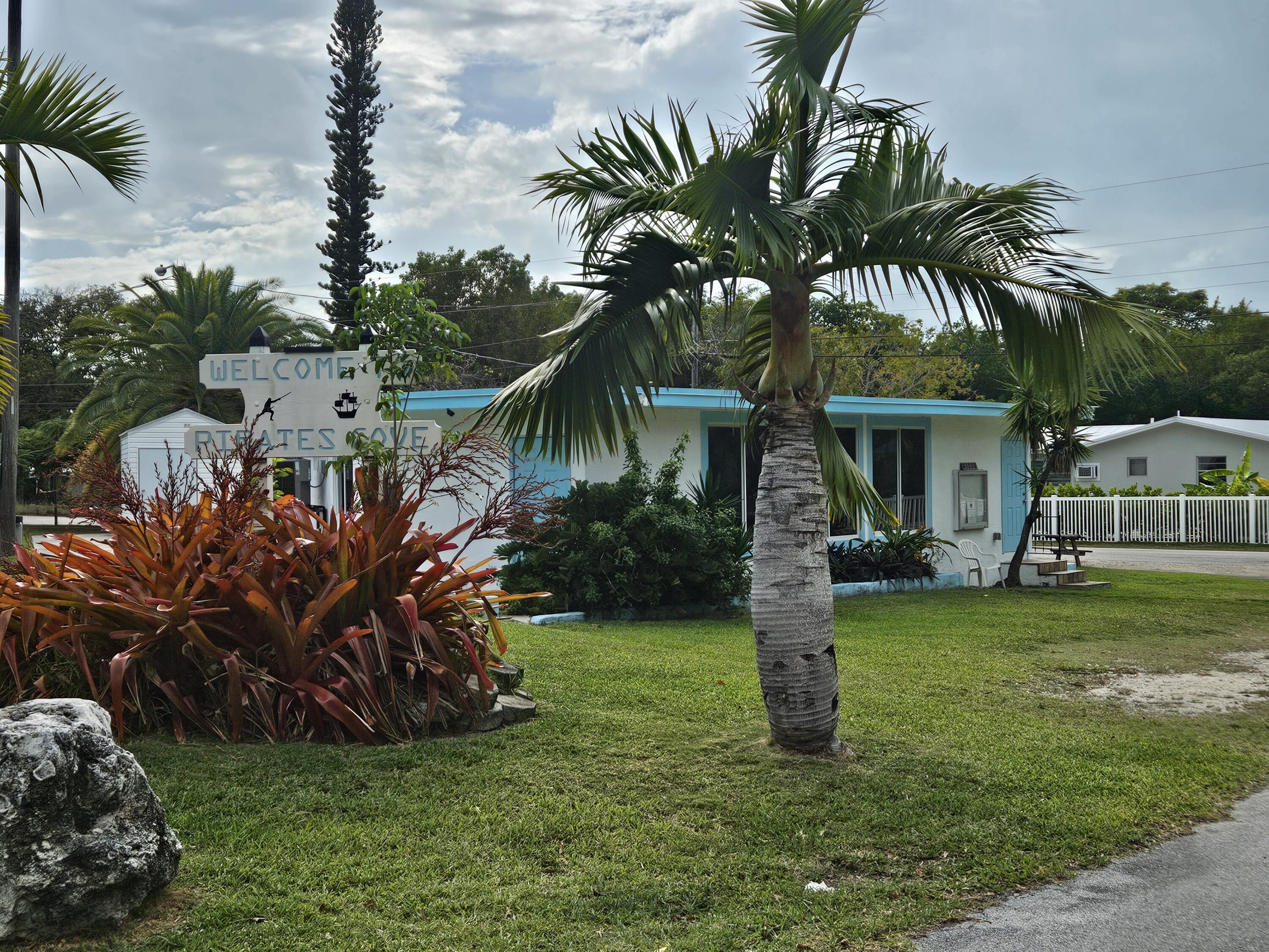 85 Henry Morgan Drive Key Largo, FL 33037 - Photo 39 of 40 a view of a house with backyard and a tree