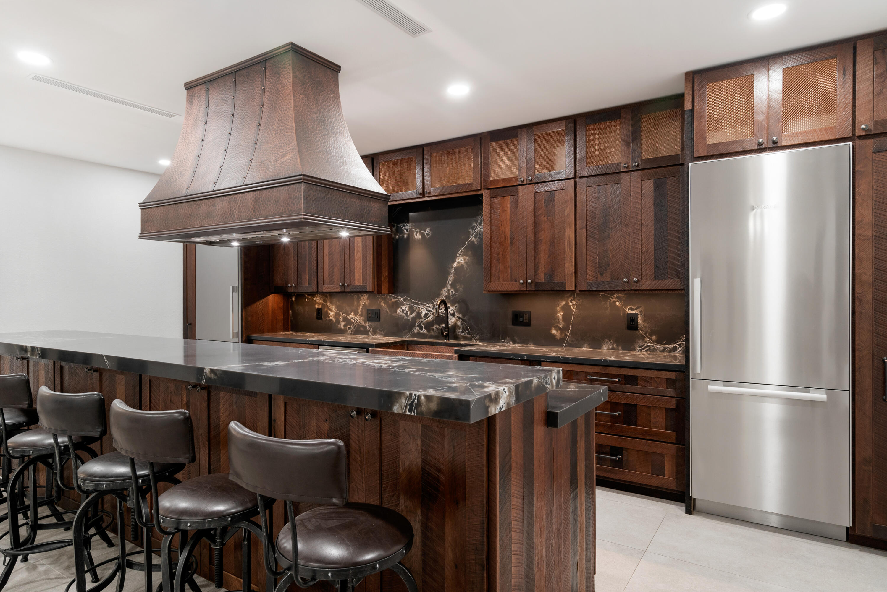 85 Henry Morgan Drive Key Largo, FL 33037 - Photo 9 of 40 a kitchen with stainless steel appliances granite countertop a stove refrigerator and wooden cabinets