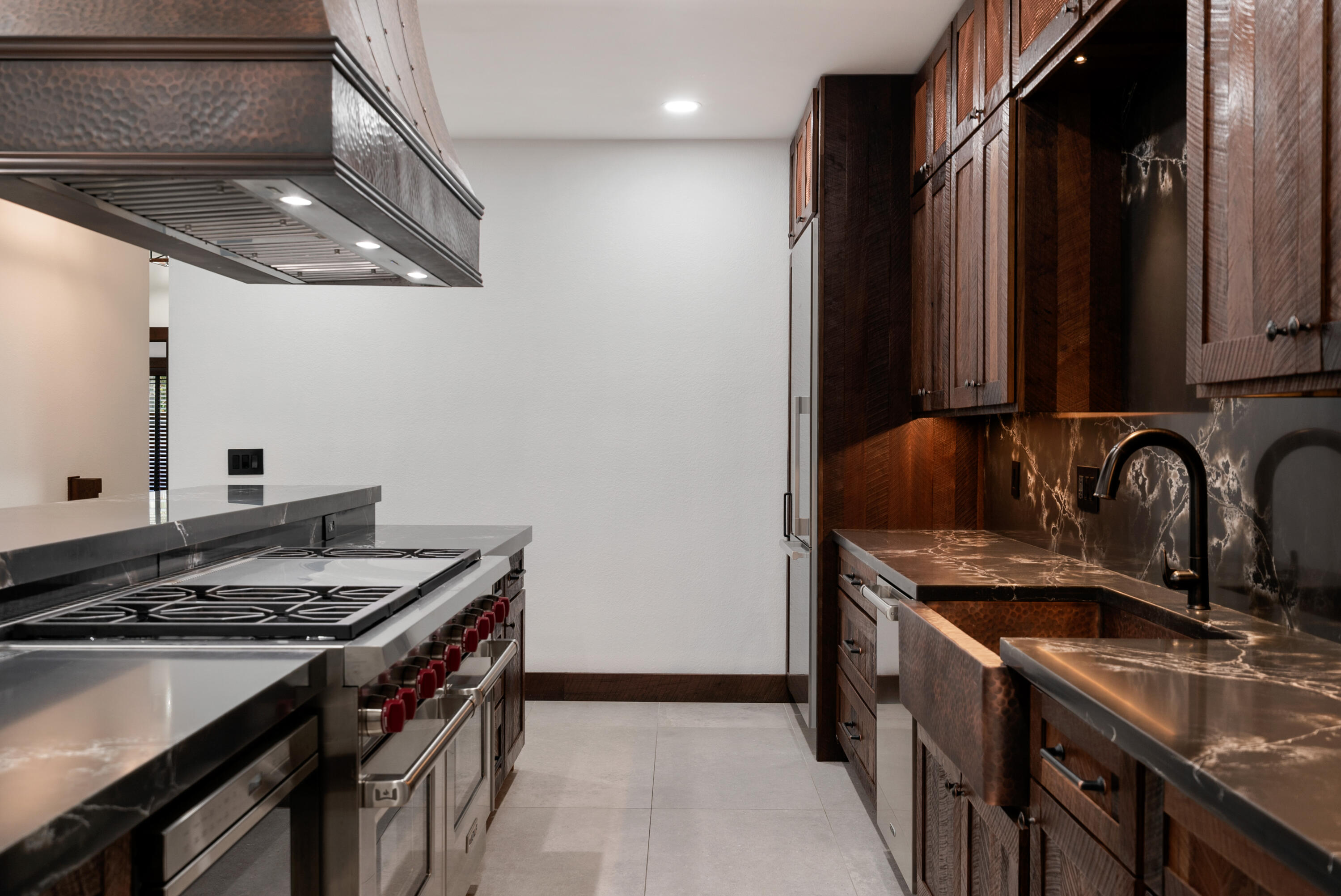 85 Henry Morgan Drive Key Largo, FL 33037 - Photo 10 of 40 a kitchen with granite countertop a sink stove and cabinets