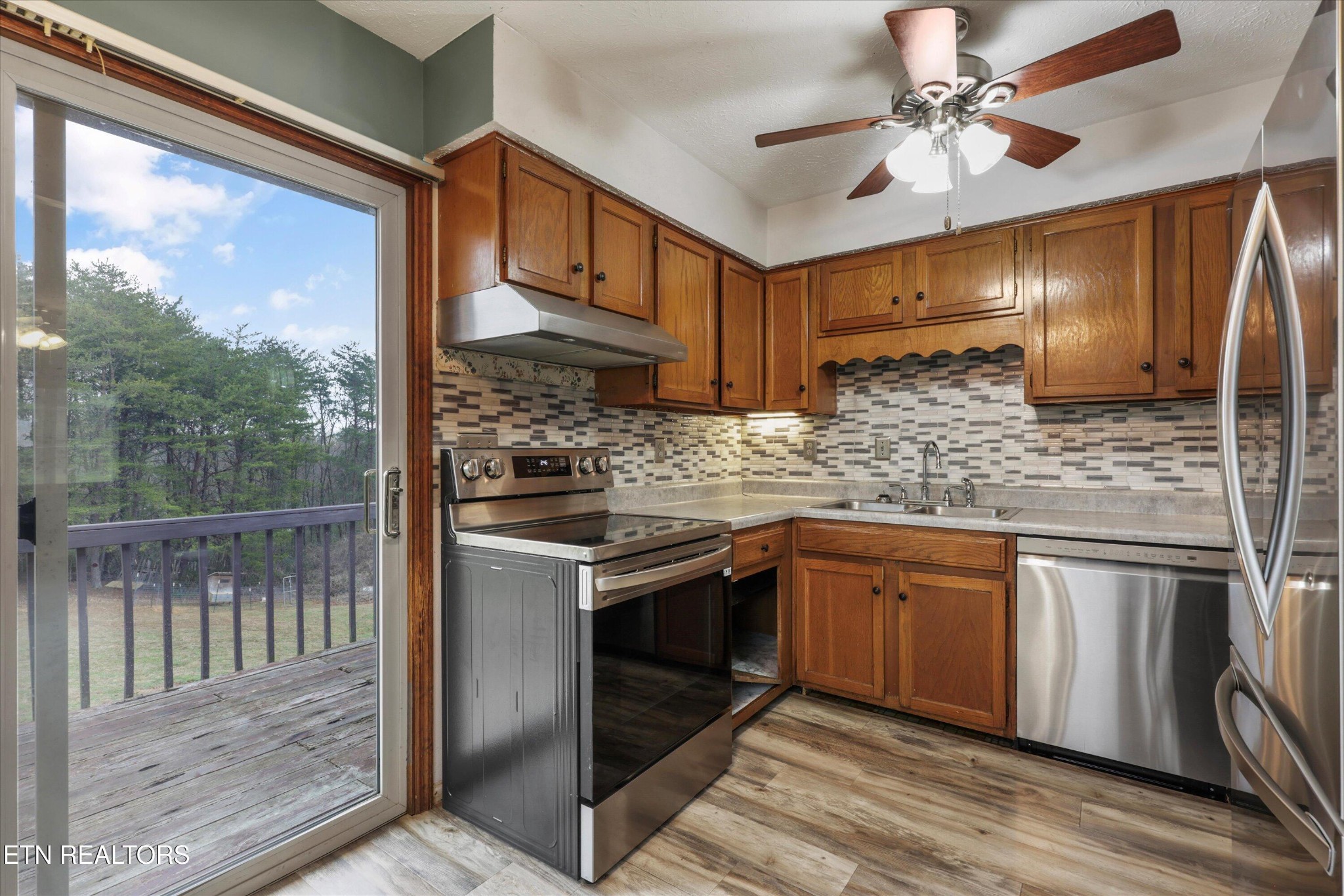 47 Paint Rock Ferry Road Kingston, TN 37763 - Photo 9 of 38 a kitchen with stainless steel appliances granite countertop a stove sink and cabinets