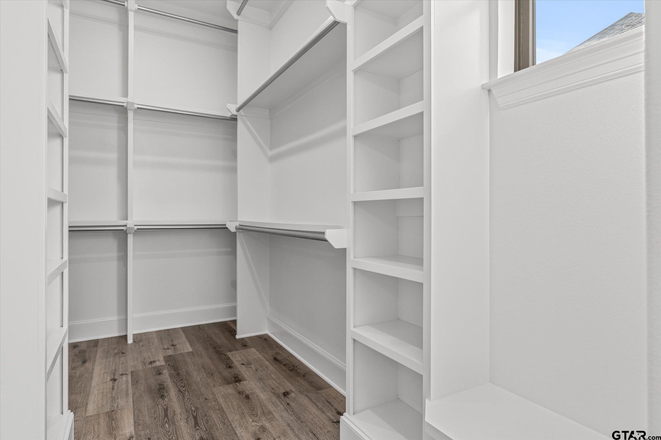 403 Sides Bullard, TX 75757 - Photo 14 of 33 a view of walk in closet with empty racks