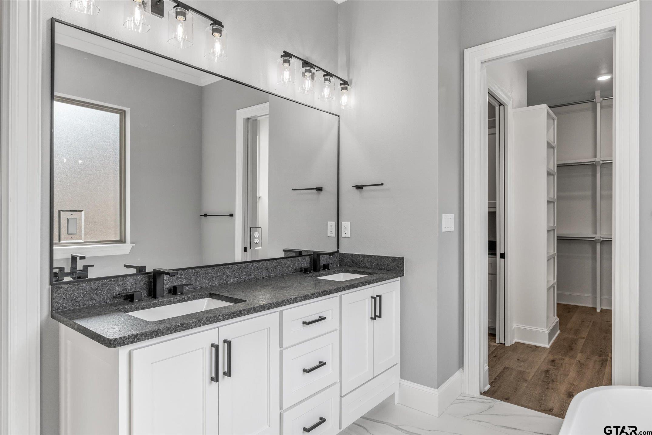403 Sides Bullard, TX 75757 - Photo 16 of 33 a bathroom with a granite countertop sink and a mirror